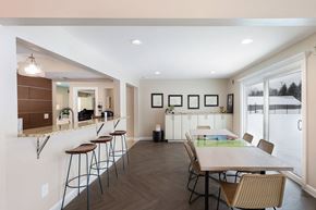 Bloomfield Hills apartment for rent - A kitchen with a table and chairs in front of a window.