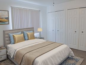 Livonia apartment for rent - A bedroom with a large bed and a painting on the wall.