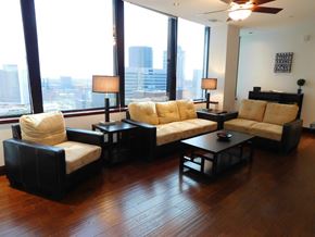 St. Louis apartment for rent - A living room with a large window overlooking the city.