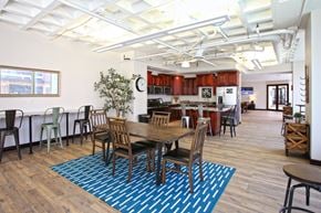 St. Louis townhouse for rent - A dining room with a table surrounded by chairs.