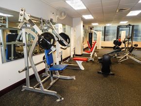 St. Louis apartment for rent - A gym with a variety of equipment including a leg press machine.