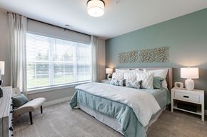 Canton apartment for rent - a bedroom with a bed and a large window