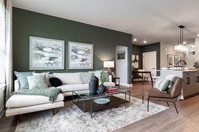 Canton apartment for rent - a living room with green walls and a white couch