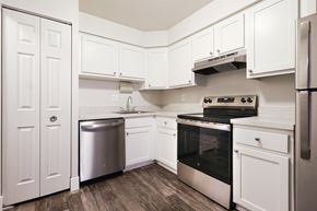 Westland apartment for rent - A kitchen with white cabinets and stainless steel appliances.