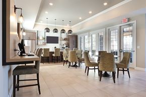 Commerce Township apartment for rent - A dining room with a table and chairs.
