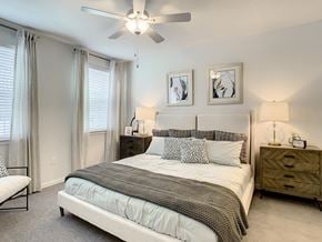 Orlando apartment for rent - a bedroom with a bed and a ceiling fan