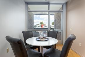 Ann Arbor apartment for rent - A dining room with a table and chairs and a view of the outside.