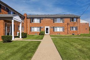 Madison Heights apartment for rent - A brick building with a white door and windows.