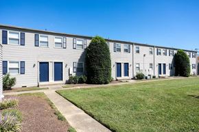Madison apartment for rent - A row of houses with blue doors and windows.