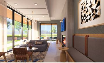 Royal Oak apartment for rent - A modern living room with a grey couch, a wooden chair, a coffee table, and a large abstract painting on the wall.