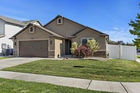 North Salt Lake apartment for rent - A house with a brown roof and a white garage door.