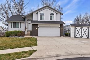Kaysville apartment for rent - A house with a grey roof and a white garage door.