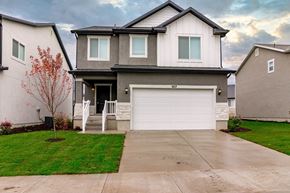 Saratoga Springs apartment for rent - a house with a white garage door on a driveway