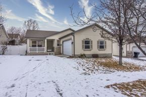 Herriman apartment for rent - the front of a house with snow on the ground