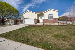 Saratoga Springs apartment for rent - the front of a house with a lawn and a driveway