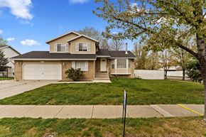 Centerville apartment for rent - a house with a lawn and a sidewalk in front of it