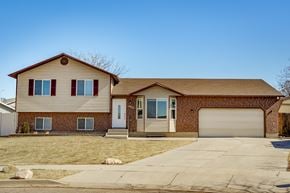 Roy apartment for rent - a house with a driveway and a garage door