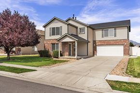 Clearfield apartment for rent - a house with a white garage door on a driveway