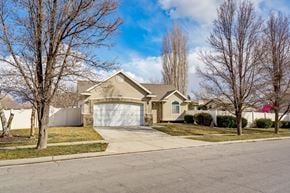 Layton apartment for rent - a house with a driveway and a garage door