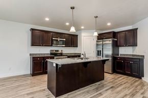 Saratoga Springs apartment for rent - a kitchen with a large island and a stainless steel refrigerator
