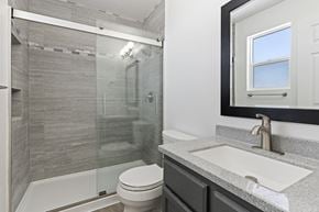 Syracuse apartment for rent - a bathroom with a sink toilet and shower