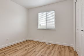 Eagle Mountain apartment for rent - an empty room with wooden floors and a window