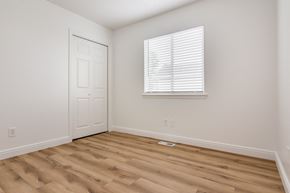 Eagle Mountain apartment for rent - an empty room with wooden floors and a window