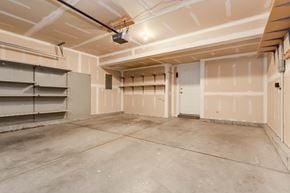 Saratoga Springs apartment for rent - the interior of a garage with white walls and a concrete floor