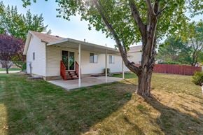 Clinton apartment for rent - a white house with a porch and a tree