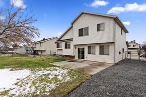 Layton apartment for rent - A house with a grey roof and a grey garage door.