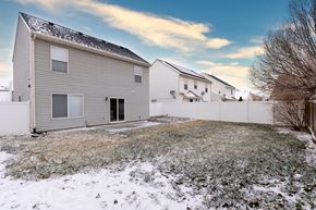Saratoga Springs apartment for rent - the back yard of a house with snow on the ground