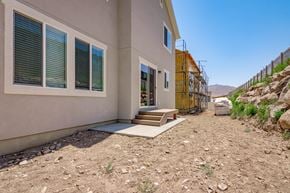 Saratoga Springs apartment for rent - the front of a house with a dirt driveway and steps outside of it