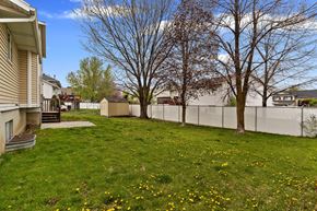 Centerville apartment for rent - the backyard of a house with a yard and a fence