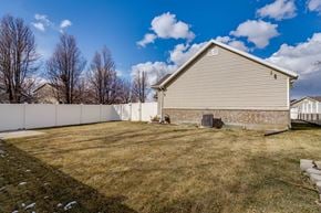 Layton apartment for rent - a backyard with a fence and a house
