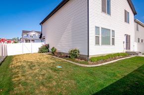American Fork apartment for rent - A house with a white siding and a green lawn.