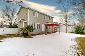 Layton apartment for rent - A house with a red awning and a white fence.