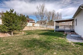 Saratoga Springs apartment for rent - the backyard of a house with a fence and a tree