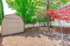 Clearfield apartment for rent - a shed in a backyard with trees and a fence