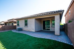 Sahuarita apartment for rent - A house with a green lawn in front.