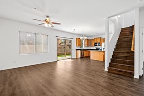 Peoria apartment for rent - a living room with a staircase and a ceiling fan