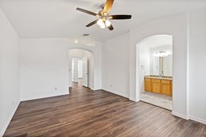 Oro Valley apartment for rent - a living room with white walls and a ceiling fan