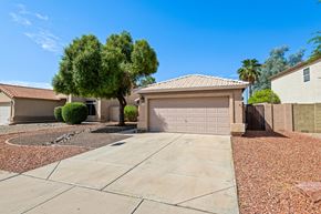 Gilbert apartment for rent - a home with a garage door and a driveway