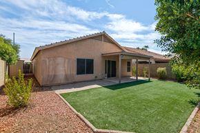 Gilbert apartment for rent - a house with a yard and a green lawn