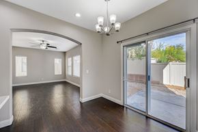 Las Vegas apartment for rent - an empty living room with a sliding glass door to a patio