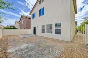 Las Vegas apartment for rent - a white house with a yard and a fence