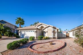 Mesa apartment for rent - a house with a courtyard in front of it and a blue sky