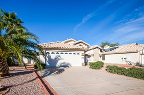 Mesa apartment for rent - a house with a garage and a palm tree