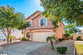 Mesa apartment for rent - a house with a garage door and a driveway