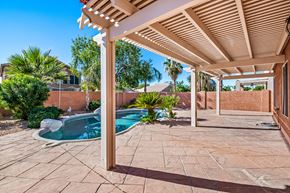 Mesa apartment for rent - the backyard has a pool and a patio with a pergola