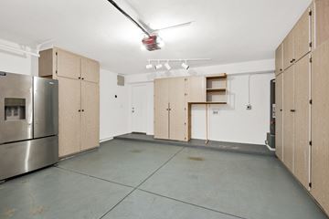 Mesa apartment for rent - A kitchen with wooden cabinets and a stainless steel refrigerator.